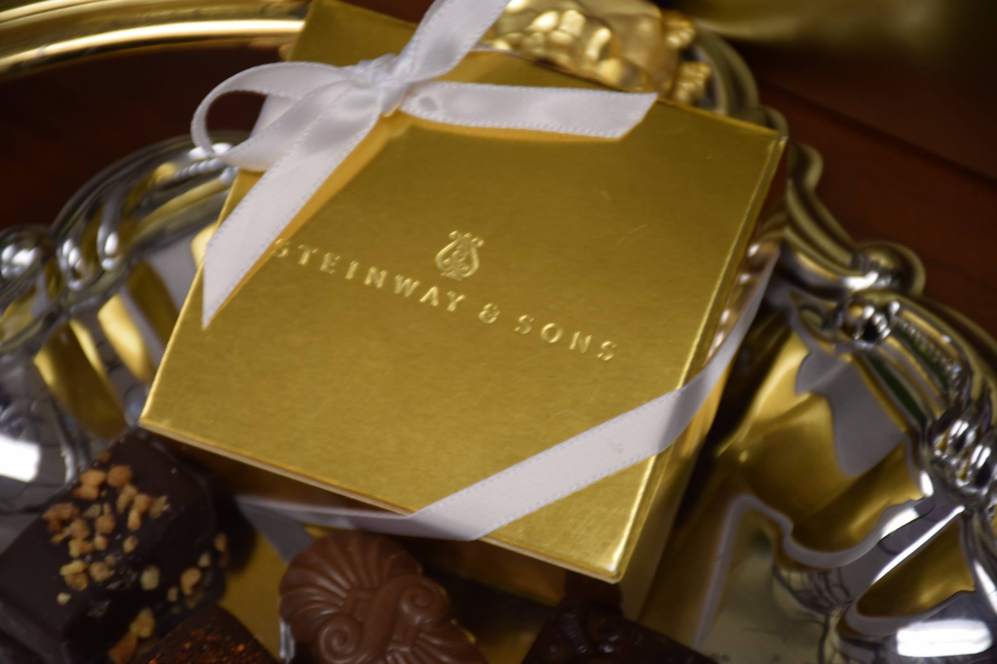 steinway and sons corporate logo on chocolate box